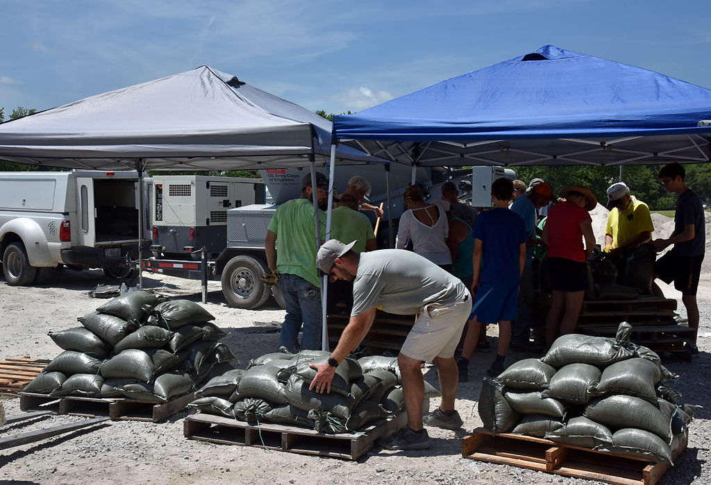 Hartsburg residents and Boone Electrical Coalition employees make sandbags
